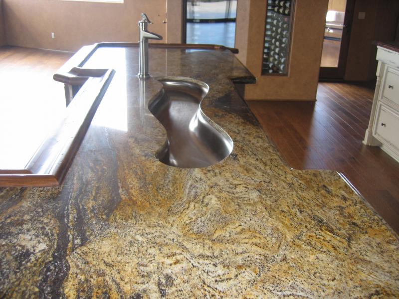 Detailed contouring granite to a river sink